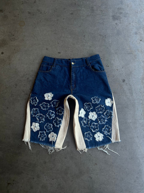 "distressed bloom jorts" (dark blue)