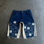 "distressed bloom jorts" (dark blue)